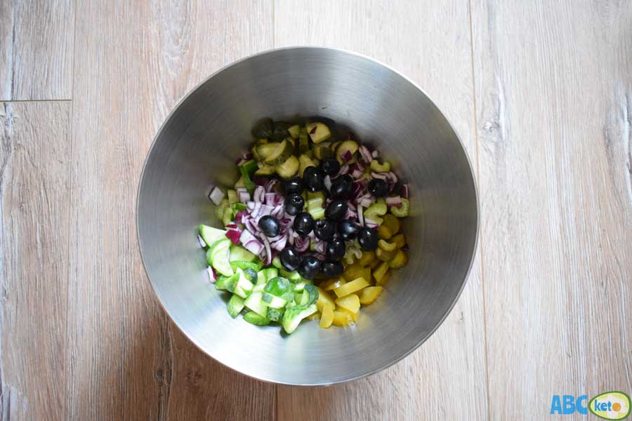 Mixing ingredients for keto cucumber salad